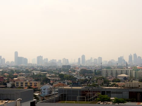 Bangkok City downtown cityscape urban skyline in the mist or smog. Wide and High view image of Bangkok city in the 
smog