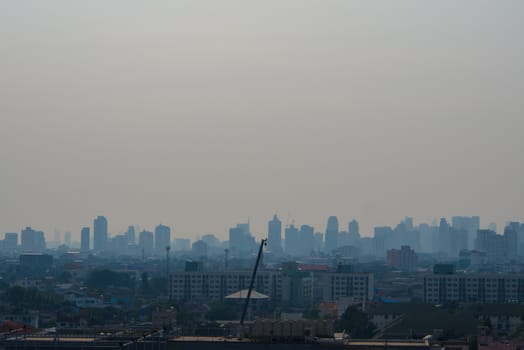 Bangkok, Thailand - Feb 13, 2018 Bangkok City downtown cityscape urban skyline in the mist or smog. Wide and High view image of Bangkok city in the soft light