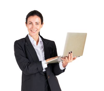 A business woman in a black suit with a smile and typing on a computer notebook. Portrait on white background with studio light.