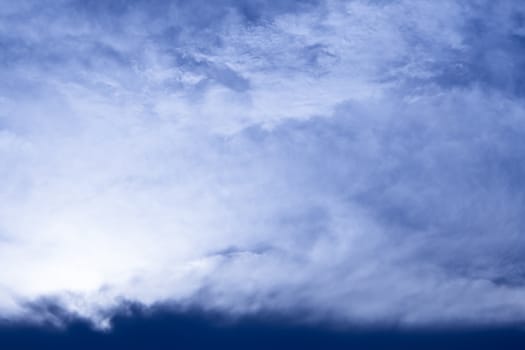 Fluffy clouds in the bright blue sky