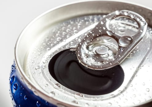 Condensation refreshing water droplets on the fresh cold soft drink can surface