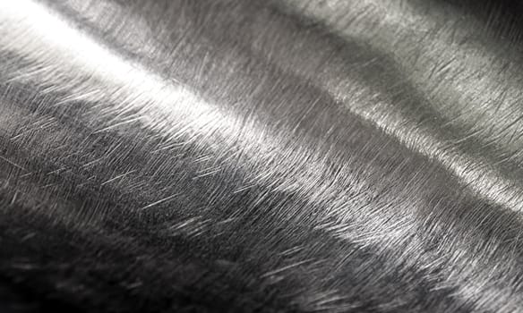 Texture of shiny surface and scratched on stainless steel round bar, industrial grunge background