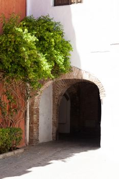 Seville, Spain - 29 July 2013: Arch in juderia, jewish neighborhood