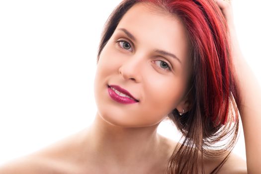 Sensual portrait of a beautiful young woman with soft clean make up, holding her hair, isolated on white background. Fashion and beauty concept.