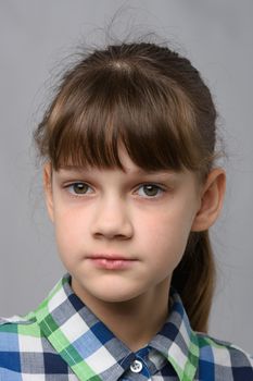 Close-up portrait of a pretty ten year old girl