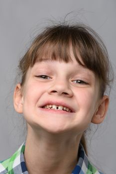 Portrait of the happiest ten-year-old girl of European appearance, close-up