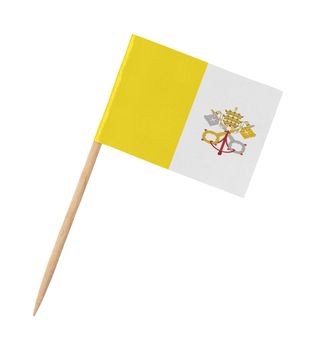 Small paper flag of the Vatican City on wooden stick, isolated on white