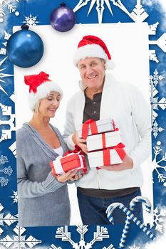 Festive mature couple in winter clothes holding gifts against christmas frame