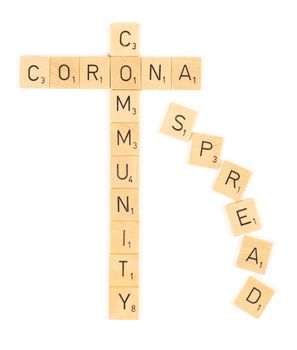 Corona community spread scrable letters, isolated on a white background