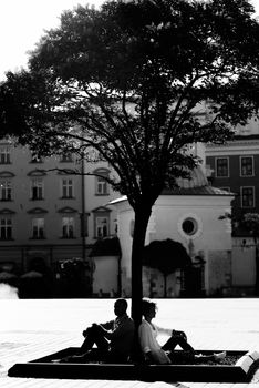 guy and a girl happily walk in the morning on the empty streets of old Europe