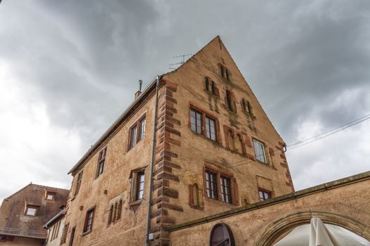 Romanesque house of the Rathsamhausens at street of Pelerins 8 by day, Obernai, Alsace, France