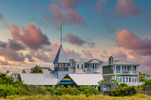 Beach entrance to grey clapboard condo complex