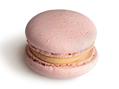 One beige macaroon angled view isolated on a white background