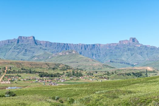 A view of the Amphitheatre in the Drakensberg with Bonjaneni township in the front