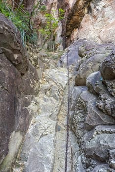 A chain on the Mudslide hiking trail to the top of Ploughmans Kop near Mahai in the Drakensberg