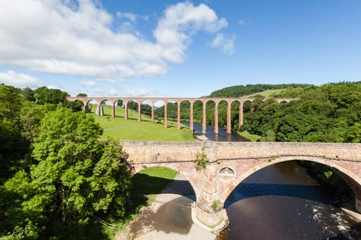 Leaderfoot Viaduct in the background is a disused railway viaduct over the River Tweed in the Scottish Borders.  In the foreground is Drygrange Old Bridge a disused road bridge.