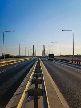 Steel barrier in center of street with driving truck over Millennium bridge in Wroclaw city