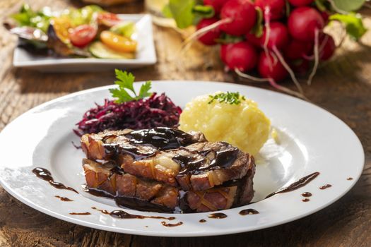 bavarian roasted pork with dumplings and cabbage