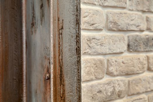 A fragment of the wall lined with white brick. Brick background.