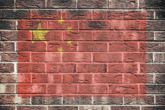 A Peoples Republic of China flag on brick wall background
