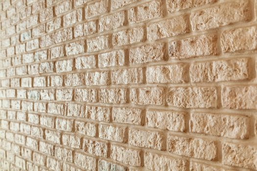 A fragment of the wall lined with white brick. Brick background.