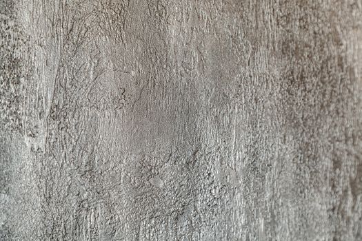 Wall fragment with grey decorative plaster texture