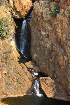A rocky freshwater waterfall cascade with pools, Rustenburg, South Africa