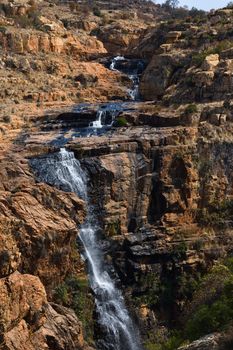 A rocky cascading river with high freshwater waterfall, Rustenburg, South Africa