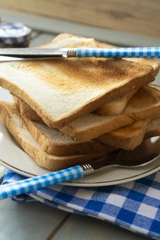 slices of rye dry bread as toast for breakfast with vintage knife. Vertical image