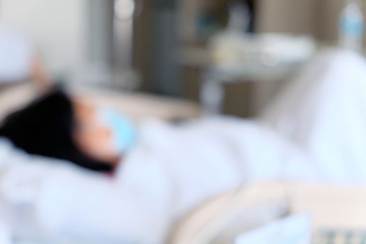 Abstract blur of Elderly patients in hospital bed background