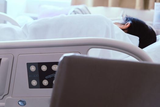 Close up of Patient bed with Elderly patients in hospital