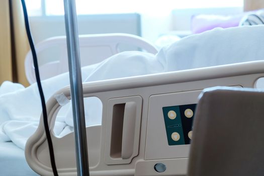 Close up of Patient bed with Elderly patients in hospital