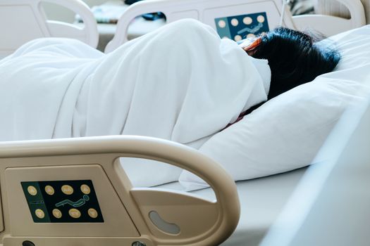 Close up of Patient bed with Elderly patients in hospital