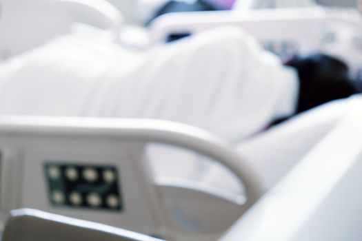 Close up of Patient bed with Elderly patients in hospital