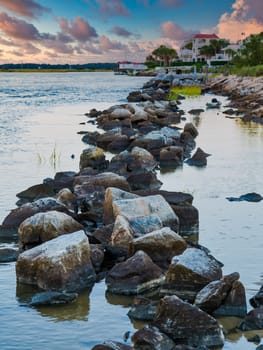 A rock seawall on the coast in a harbor