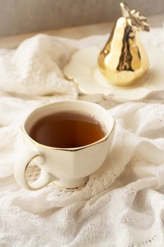 Afternoon tea in white vintage cup, vertical image