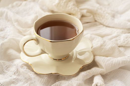 Antique tea cup on white background, mornong elegant image