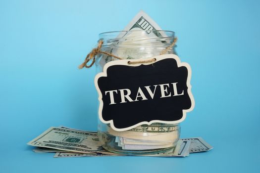 Savings for vacation and travel. Jar with plate and money.