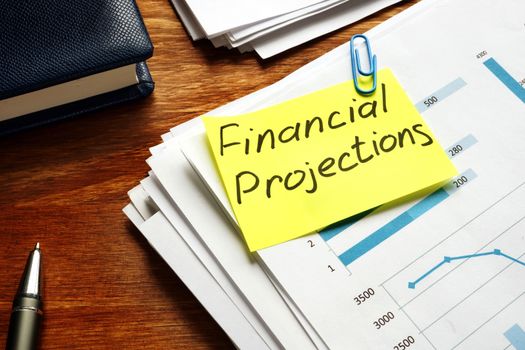 Financial Projections label on a pile of business documents.