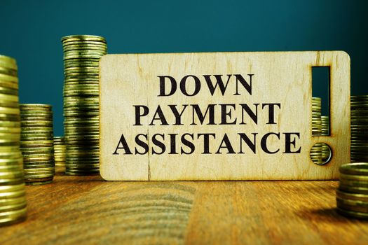 Down Payment Assistance sign on a wooden plate.