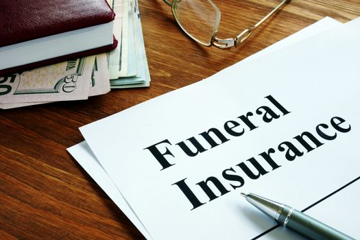 Funeral insurance agreement, money and glasses.