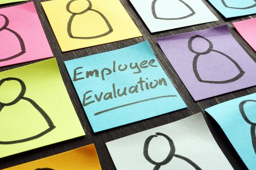 Employee evaluation concept. Colored memo sticks.