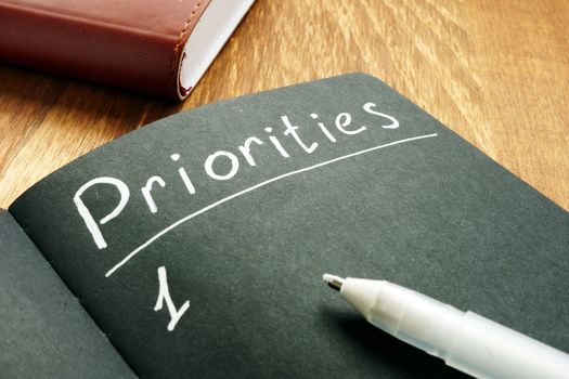 Priorities list in the black notepad.