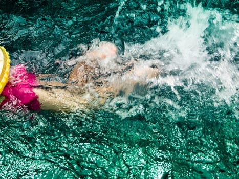 Children are swimming in the pool