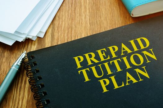 Prepaid Tuition Plan and papers with pan. Loan for education concept.