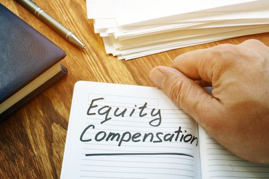 Equity compensation words in the brown notebook.