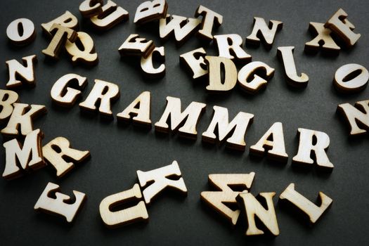 Grammar word from wooden letters. Learn English concept.