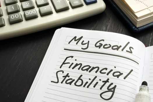 Personal goal - financial stability inscription on the sheet.