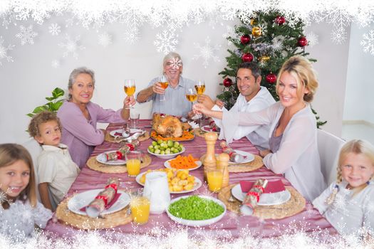 Family raising their glasses at christmas against fir tree forest and snowflakes