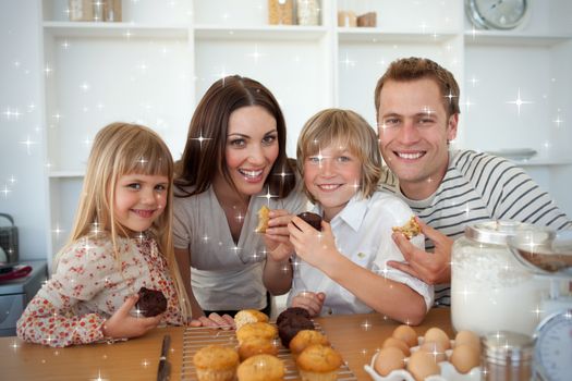Cute children eating muffins with their parents against snow